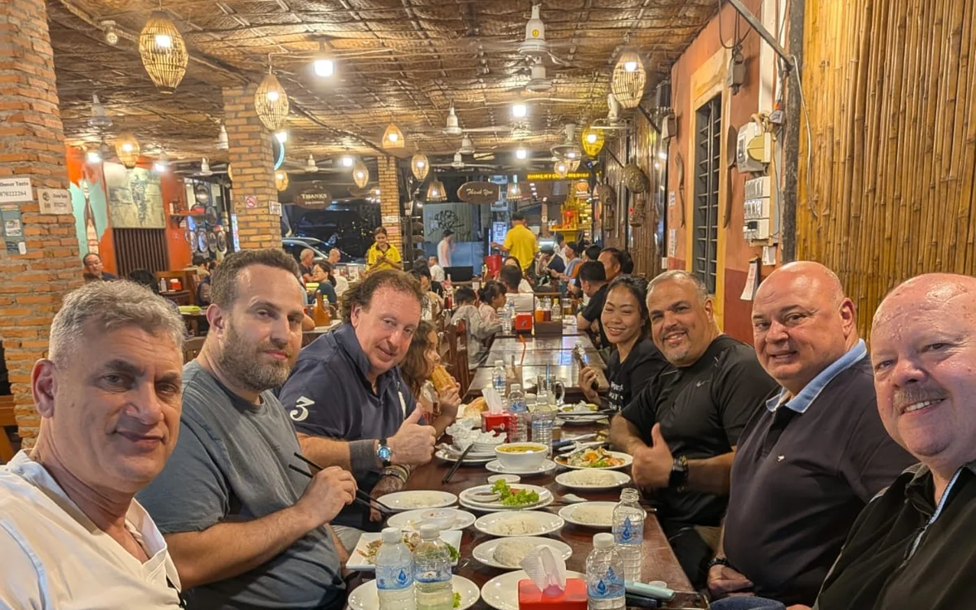 AWWW8 guests sharing a meal together in Siem Reap